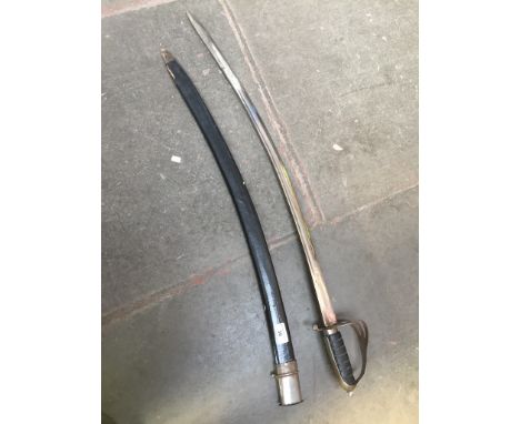 A decorative sabre in black scabbard 