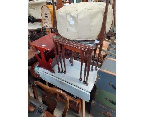 7 items of furniture; a white drop leaf table, a mahogany nest of tables, a cane seat mahogany stool, a retro style pouffe, a