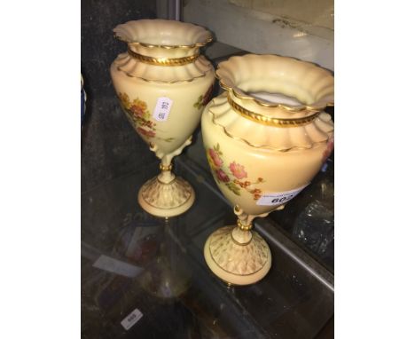 Pair of Royal Worcester blush ivory hand painted vasesCondition: minor signs of wear to gilded decoration otherwise no signs 