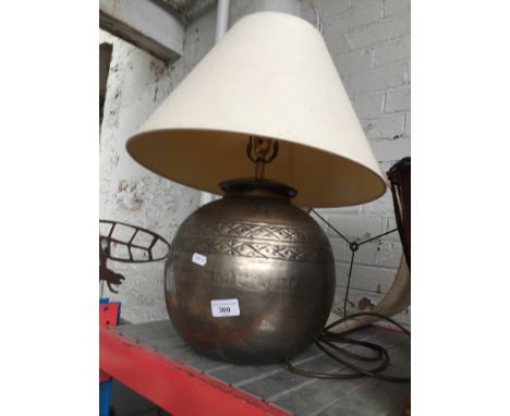 A modern table lamp with additional shade. 