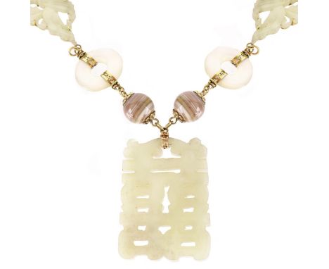 Vintage Jade, Hardstone and 14 Karat Yellow Gold Pendant Necklace. Carved celadon jade pendant measures 2-1/4" H, 1-5/8" W; n
