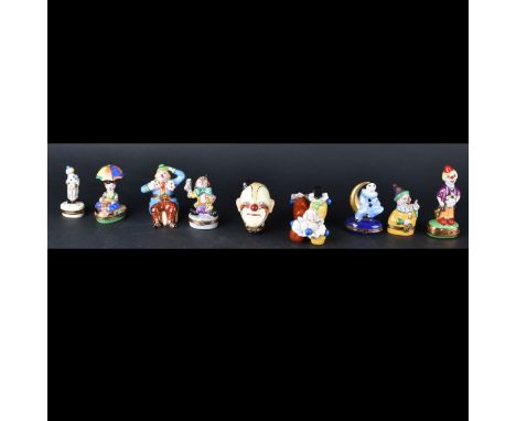 Grouping of Nine (9) Vintage Hand Painted Clown Figurines. Mainly Limoges France pill boxes and single figurine is made in Ja