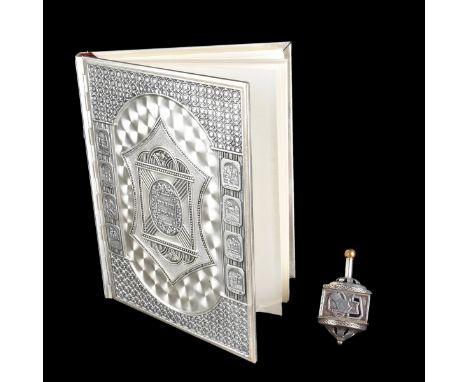 Two (2) Piece Judaica Lot. Includes: sterling silver dreidel/spice box. Marked sterling. Measures 3-1/4" and weighs approx. 2