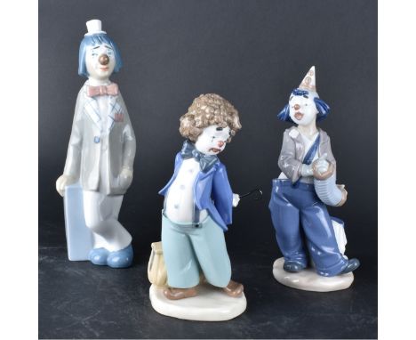 Three (3) Lladro Style Porcelain Figurines. Includes 2 Nao and 1 Casades figurines. Marked to base. Tallest measures 9-3/4" H