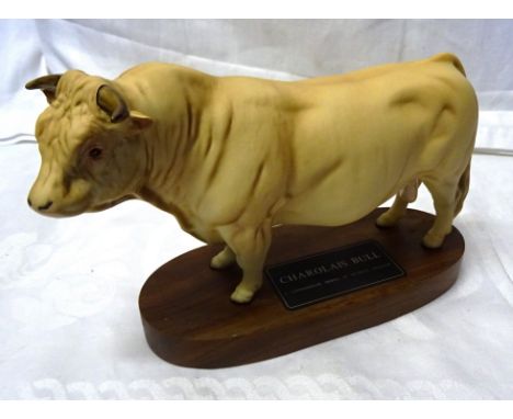 A Beswick model of a Charolais bull on a wooden plinth No. A2463A from the Connoisseur Cattle Series. 