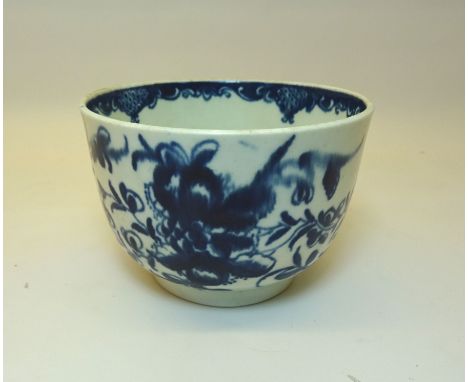 An 18th Century Worcester first period circular Bowl decorated with flowers in blue and white and with crescent mark to base.