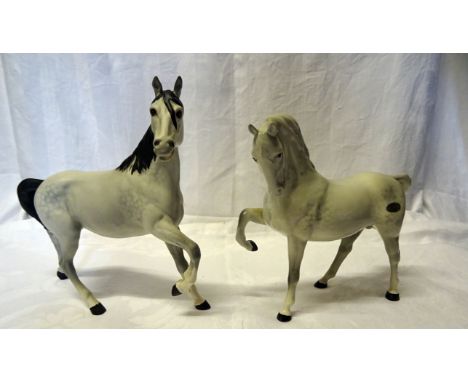 A Beswick Model of a grey horse with head tucked, No. 1549, first version and a Beswick matt grey model "Spirit of the Wind",