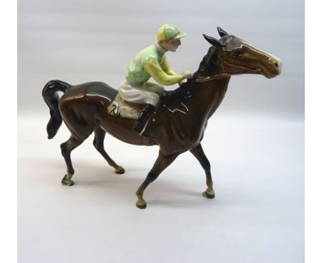 A Beswick Model of a racehorse and jockey, No. 1037, second version, with the number 24 on the saddle cloth in brown gloss. 