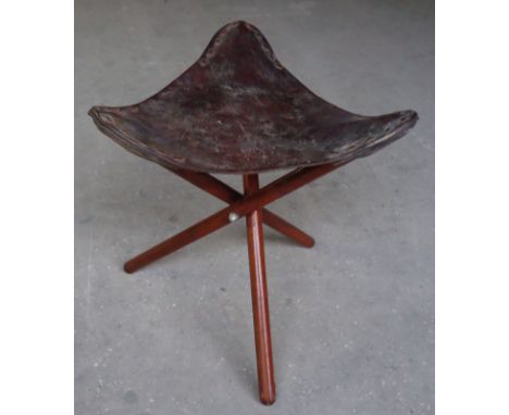 A leather seated tripod Stool. 