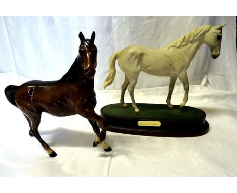 A Beswick Model "Spirit of the wind" in brown gloss, No. 2688 and a Royal Doulton model of "Desert Orchid" on a wooden base. 