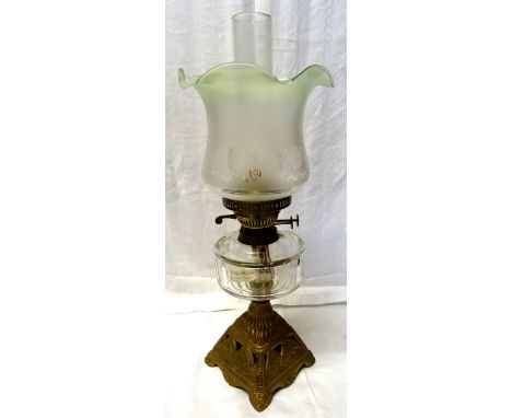 A table Oil Lamp with frosted glass shade and clear glass reservoir on a metal base. 