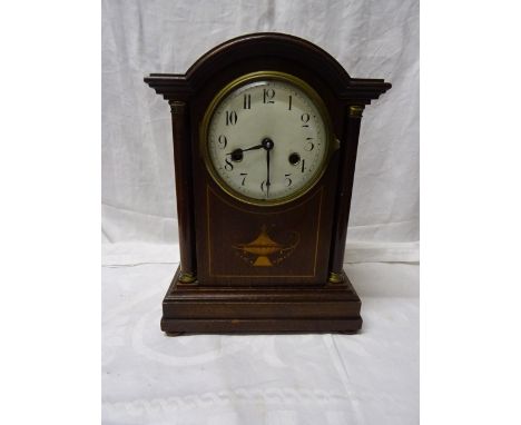 An Edwardian Mantel Clock with white dial and German movement with gong strike in domed inlaid mahogany case. 12 1/2" (32cms)