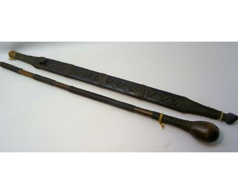 A Shona, Zimbabwe short Sword with wooden scabbard, hatch carved and wire work decoration, 32" (81cms) long overall and a Sho