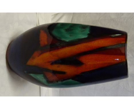 A Poole Pottery Vase of compressed oval design decorated with a geometric abstract design in orange, blue, green etc. 10" (26