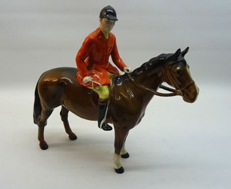 A Beswick Model of a huntsman on a brown horse, No. 1501. 