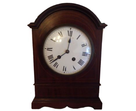 An Edwardian Mantel Clock with white dial in domed mahogany case and on bracket feet.  12" (31cms) high.