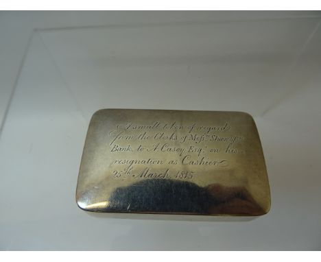 A George III silver oblong Snuff Box, the hinged lid inscribed 'To A. Casey from the Clerks of Shaw & Co. Bank, March 1815', 