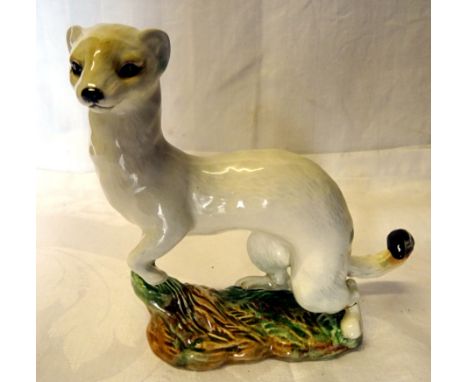 A Beswick Model of a stoat in white winter coat, No. 1021, withdrawn 1963 (a/f). 