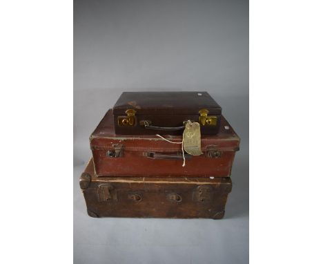 Three Vintage Suitcases and a Hessian Sack 