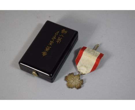 A Japanese WWII Silver Medal, the Order of the Rising Sun in Original Lacquer Box 