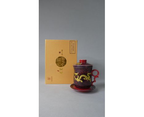 A Boxed Chinese Ceramic Teacup, Strainer &amp; Saucer Set 