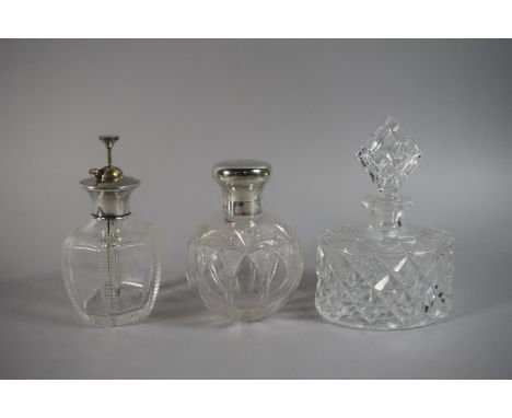 A Silver Topped Glass Atomiser, a Silver Topped Glass Scent Bottle Monogrammed WBGC 1914 and a Glass Scent Bottle 