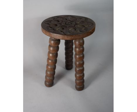 A Small Oak Bobbin Legged Stool with Carved Circular Top, 25.5cms Diameter 