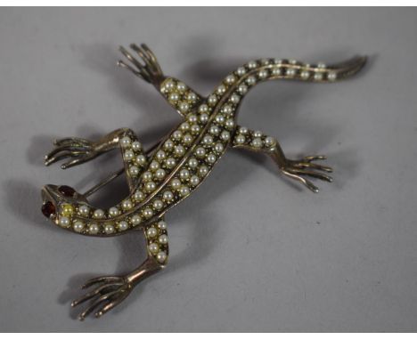 A Silver and Seed Pearl Brooch in the Form of a Lizard, 8cms Long 