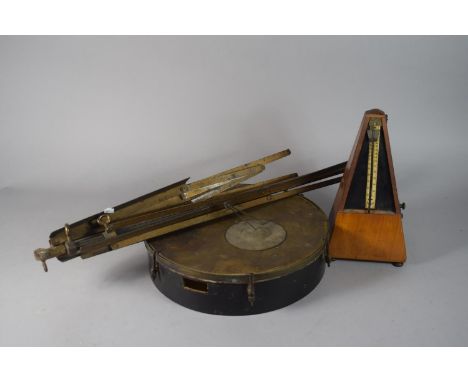 A Vintage Irish Bodhran Drum, 27cms Diameter, a Metal Music Stand and a Metronome 