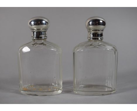 A Pair of Silver Topped Glass Dressing Table Bottles, 10cms High, London Hallmark (Rubbed) 