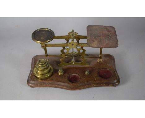 A Vintage Set of Postage Scales and Various Brass Weights, 24cms Wide 
