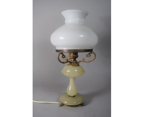 A Victorian Style Brass and Onyx Table Lamp with Opaline Glass Shade in the Form of an Oil Lamp, 38cms High 