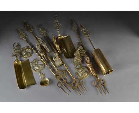 Brass Punch and Judy items: including five door knockers; four toasting forks; two crumb trays; a tea caddy spoon; and two pa