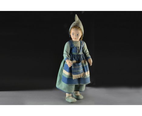 A large Norah Wellings pressed felt Dutch girl, with blue painted side-glancing eyes, light brown mohair wig, cloth body with