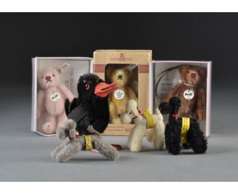 Three Steiff post-war miniature poodles, one black, grey and white, each with a yellow tag and script button around waist - 3