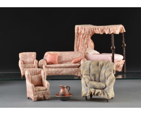 A set of Westacre dolls’ house bedroom furniture: comprising a four poster bed with pink floral upholstery - 5in. (13cm.) hig