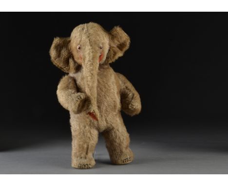 An amusing British anthropomorphic elephant 1920s, possibly Einco, with blue mohair, white googly glass eyes with orange and 