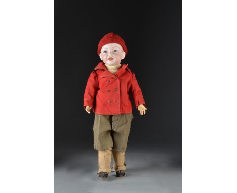A S.F.B.J. 226 character boy doll, with fixed blue eyes, open/closed laughing mouth, blonde painted hair with slight moulding