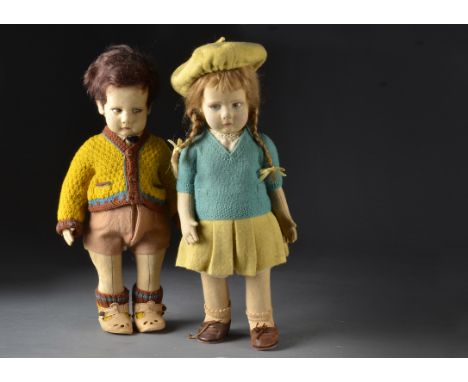 A pair of Lenci pressed-felt girl and boy, the boy with brown painted side glancing eyes, dark brown mohair wig, jointed clot