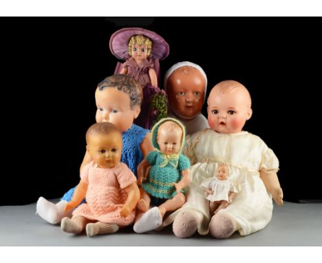 Seven Japanese, French and German celluloid dolls: comprising a Minerva baby doll with stuffed body - 231?2in. (60cm.) high; 
