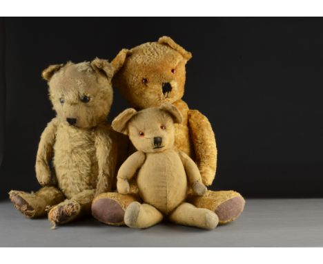 A Chiltern Hugmee teddy bear 1940s, with clear and black glass eyes with brown painted backs, black stitched nose, mouth and 