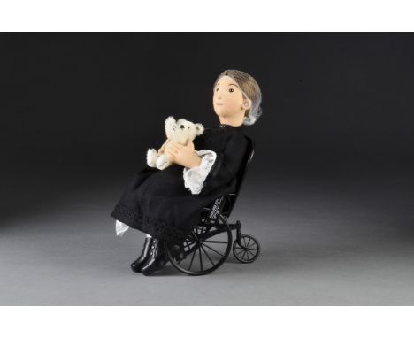 A Steiff Limited Edition Margarete Steiff felt doll, 104 of 750, with white jointed teddy bear and metal wheel chair, in orig