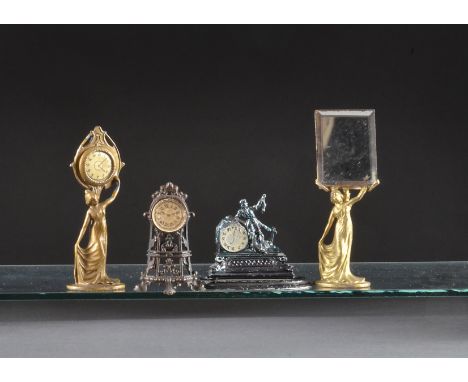 An Art Nouveau gilt painted cast metal lady mirror, and a similar clock - 31?2in. (9cm.) high; and two other mantel clocks (o