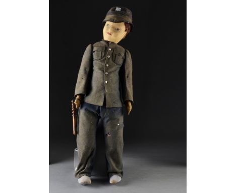 A large Chad Valley Policeman doll, with pressed felt face, jointed velvet body, original blue wool uniform with helmet, wood