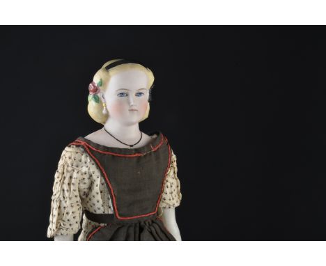 A rare German bisque shoulder head Parian-type doll, with deep blue painted eyes, feathered brow, closed mouth, moulded drop 