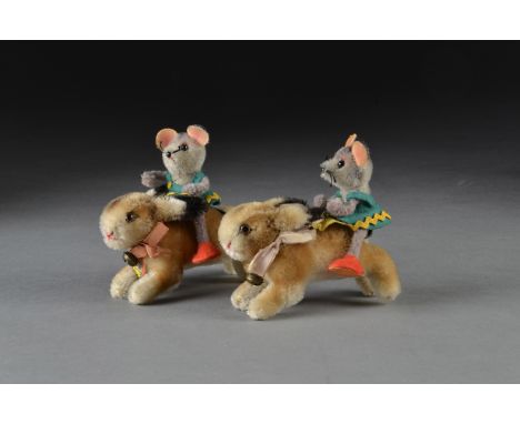 Two Steiff post-war running rabbits, one with script button and yellow cloth tag; and one with chest tag - 41?4in. (11cm.) lo
