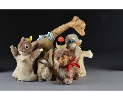 Steiff post-war animals: a Nosy rhino with chest tag - 7in. (18cm.) long; a Hopsi grey squirrel hand puppet with script butto