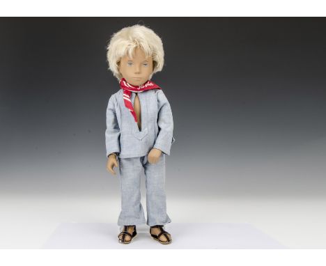 A Trendon Sasha doll Gregor Fair Blue Suit, 302, with light blonde hair, pale denim trouser suit, red neckerchief and sandals