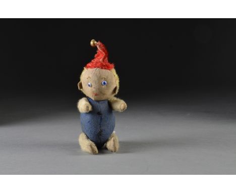 An Einco baby clown doll 1915-20, with cloth face, stitched nose, mouth and eye browns, white glass googly eyes with blue and