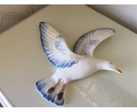 A striking Staffordshire seagull wall figurine, beautifully crafted in ceramic with hand-painted details. This elegant piece 